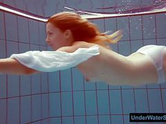 NymphoClips presents: Redhead in a white dress and sexy bikini